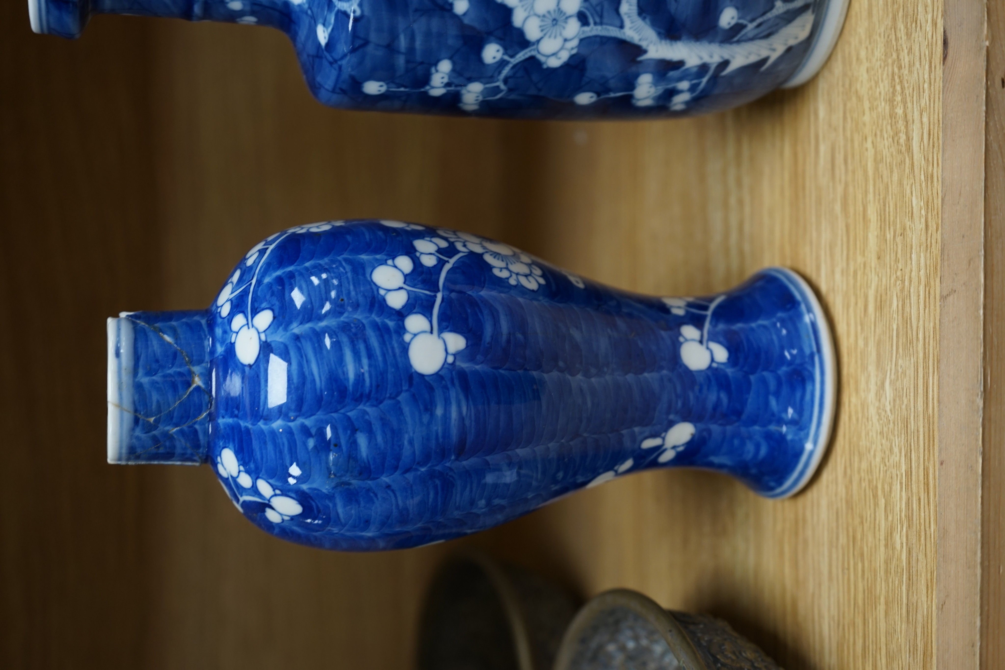 Three Chinese blue and white prunus vases. 25.5cm